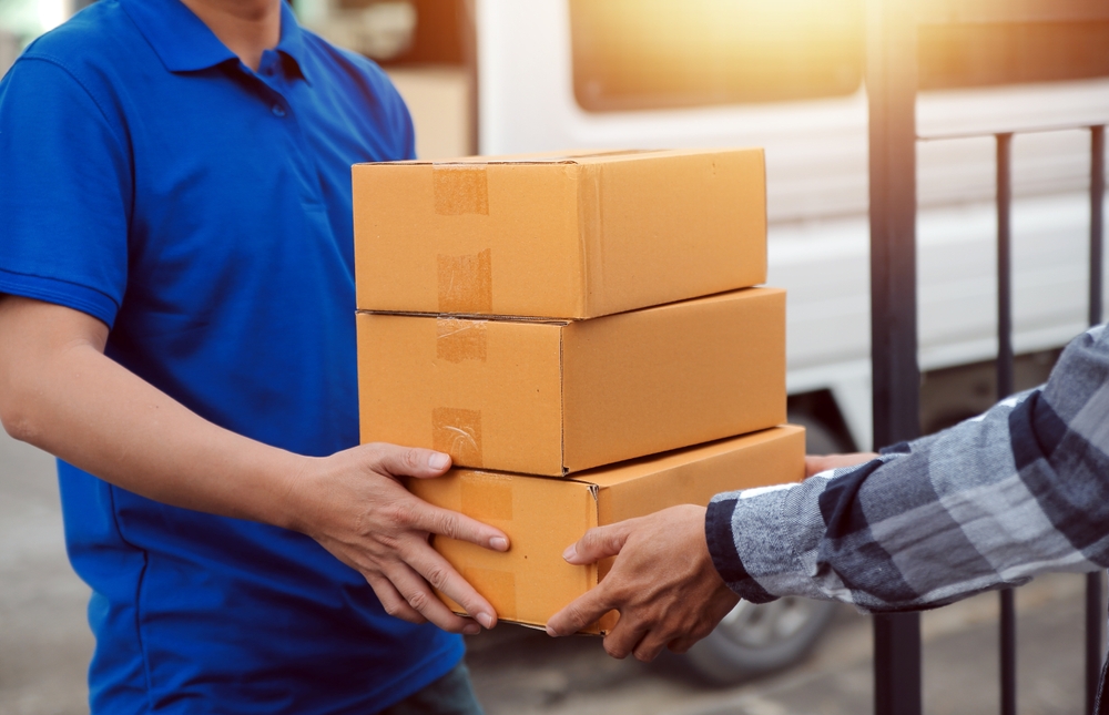 courier handing over packages
